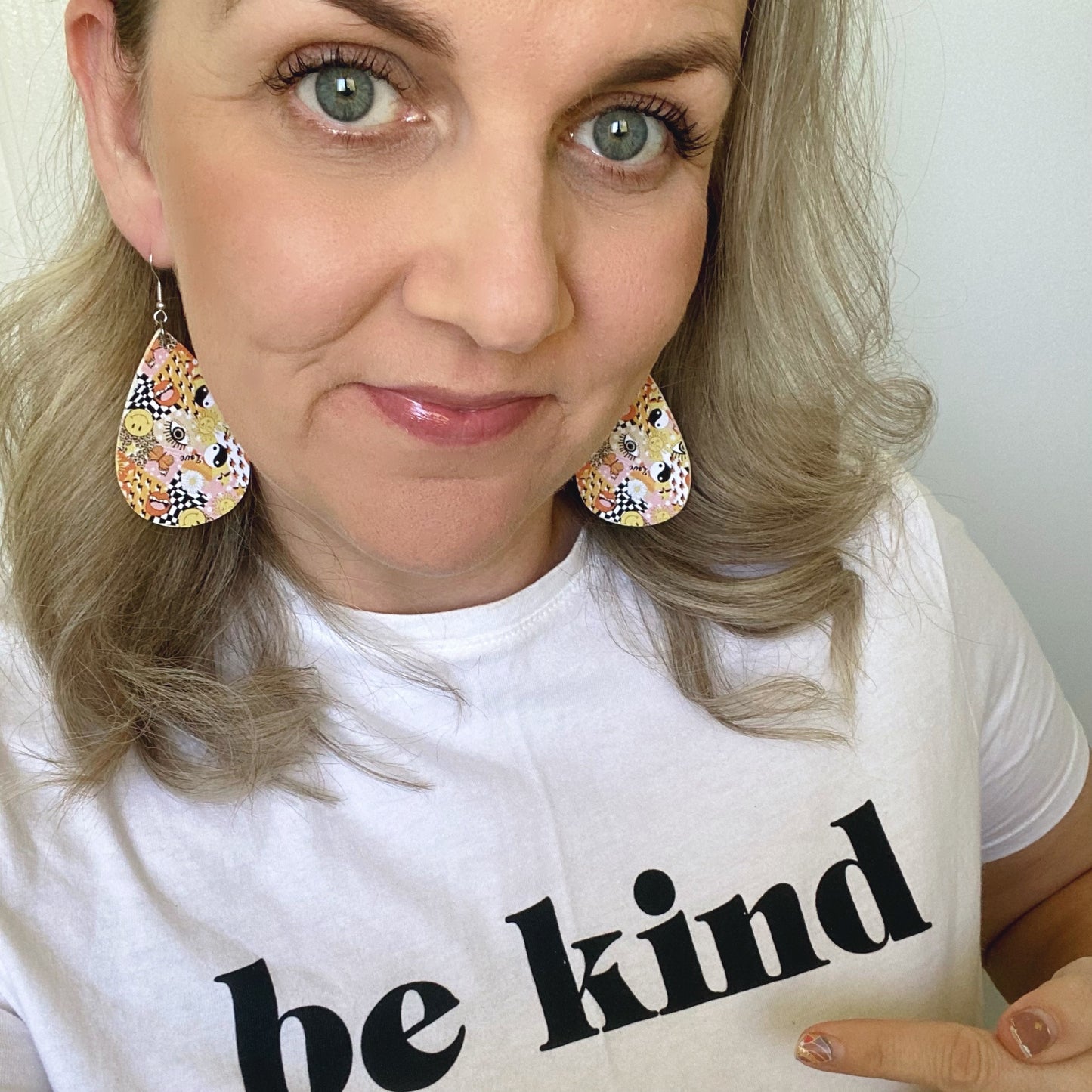 Y2K teardrop leather earrings on a silver coloured hook.