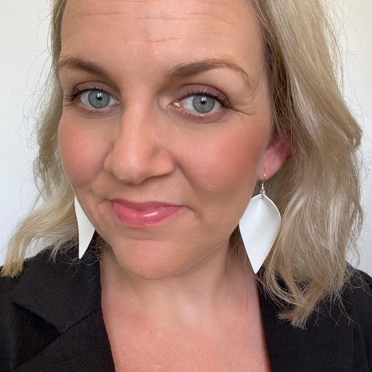 White Petal leather earrings with Silver coloured hook.