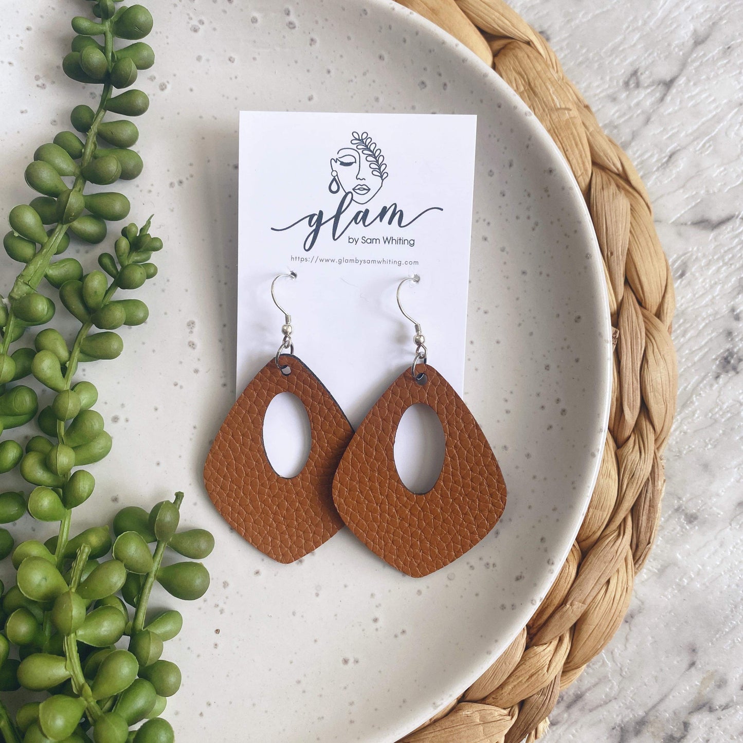 Tan leather earrings in a kite shape