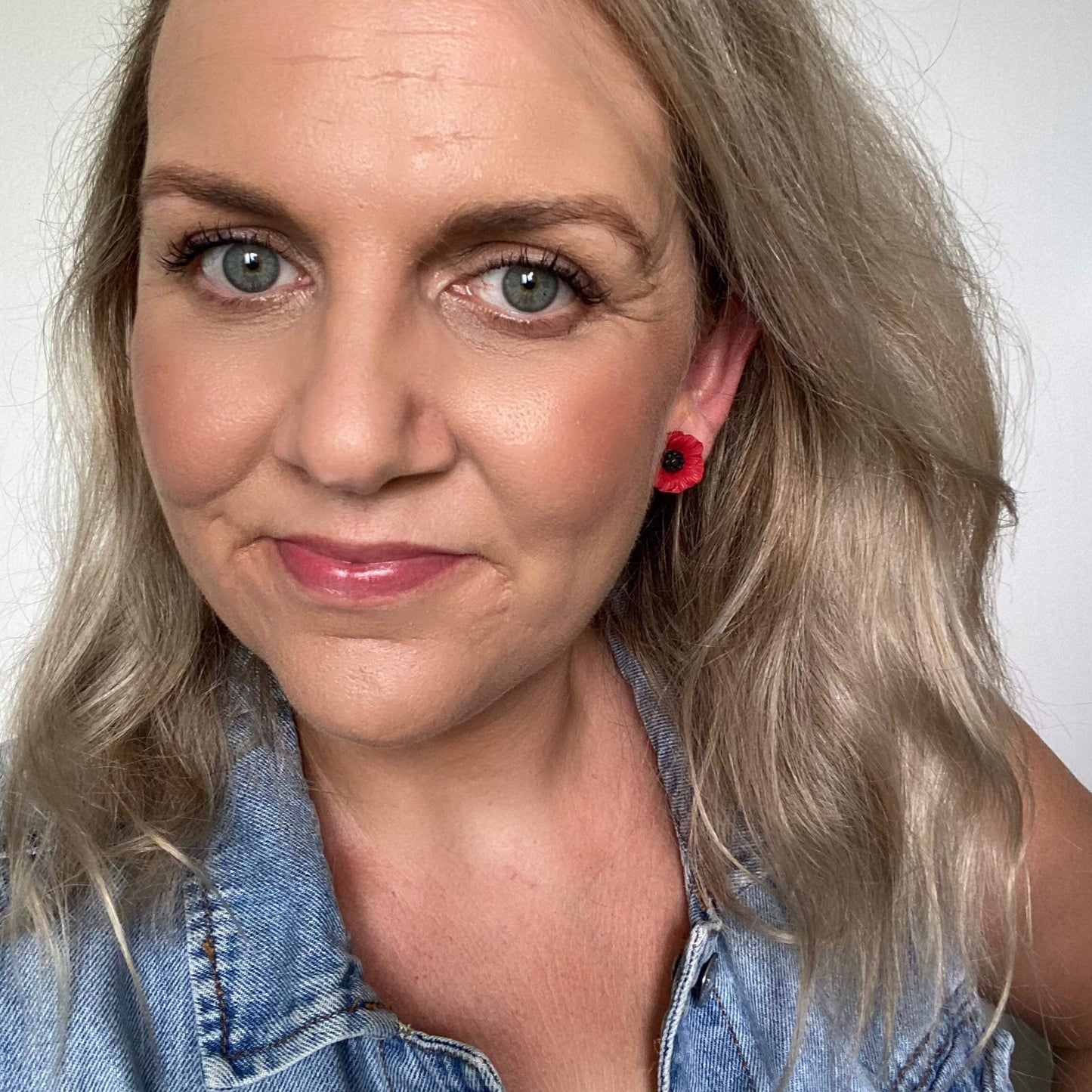 medium Resin Poppy studs with hypoallergenic stud posts. selfie