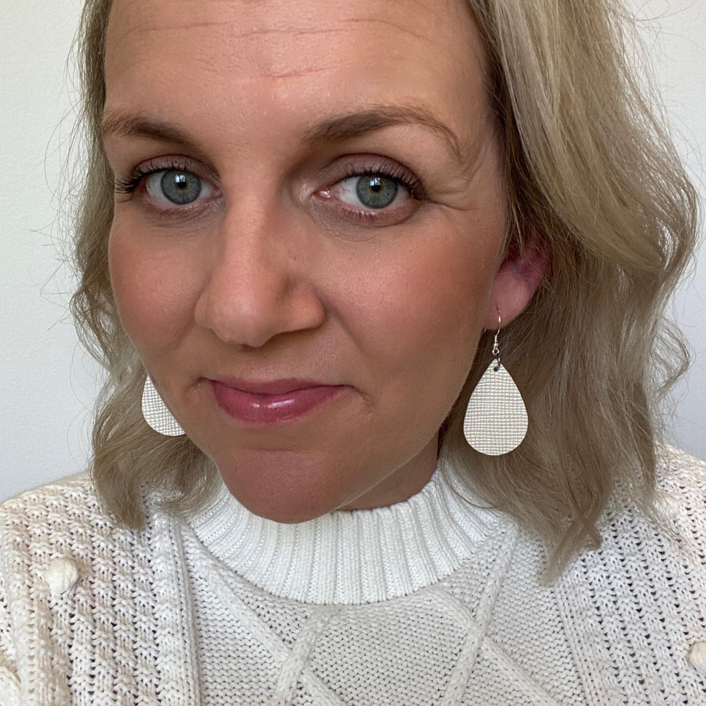 Pearl Embossed Mini leather earrings with silver coloured hook.