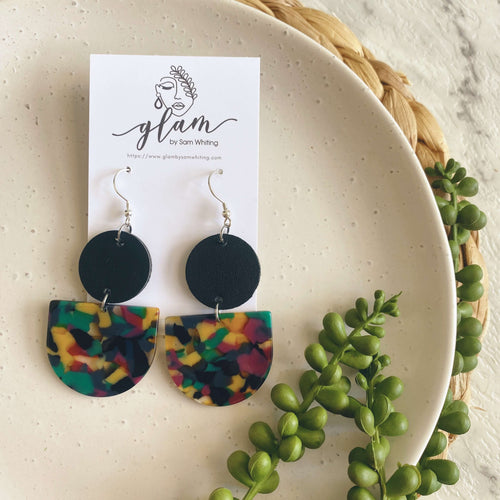 Tango earrings. Black leather circle with an acrylic piece in winter colours. leather and acrylic earrings