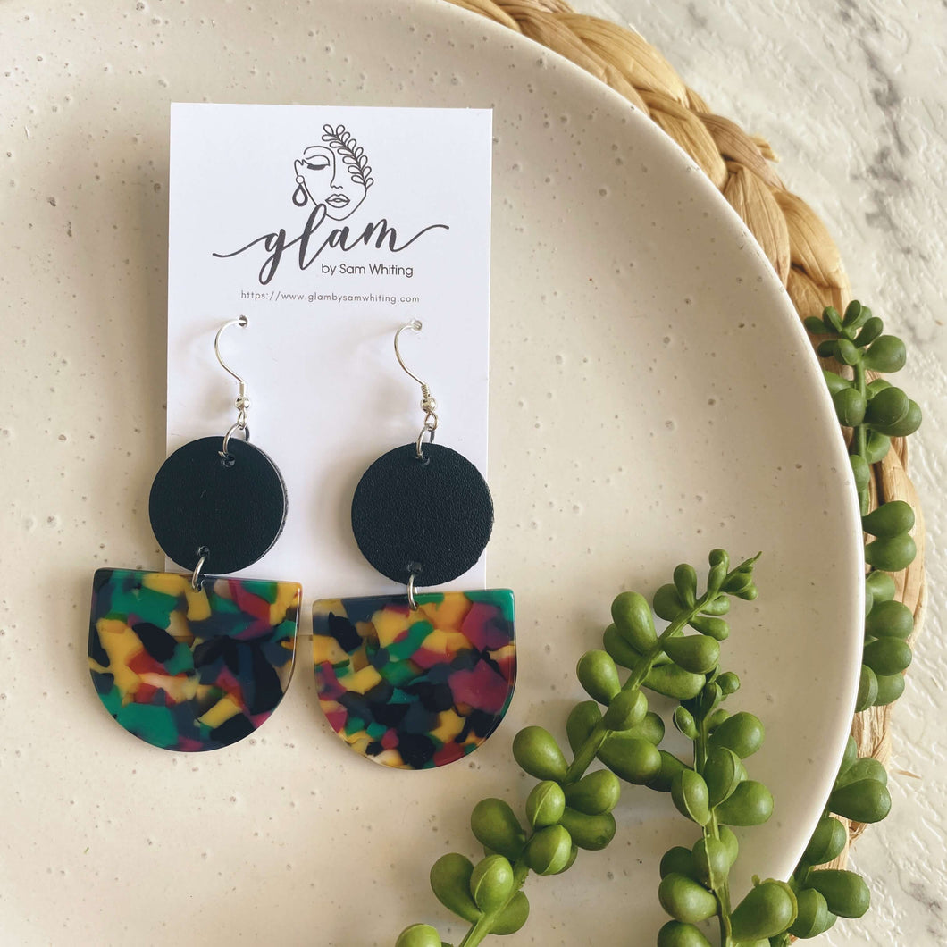 Tango earrings. Black leather circle with an acrylic piece in winter colours. leather and acrylic earrings