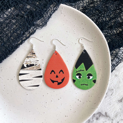 Frightful friends. Leather Halloween earrings teardrop. Pumpkin, Frankenstein, Mummy