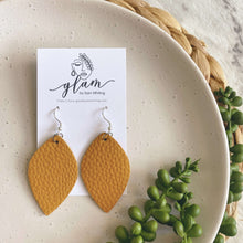 Load image into Gallery viewer, mustard leaf shape midi sized leather earrings
