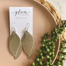 Load image into Gallery viewer, Champagne silver coloured double swirl leather earrings
