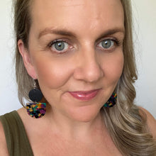 Load image into Gallery viewer, Tango earrings. Black leather circle with an acrylic piece in winter colours. leather and acrylic earrings
