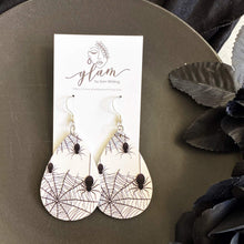Load image into Gallery viewer, black and white halloween teardrop earrings on silver hooks.  spiderweb selfie

