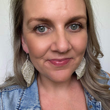 Load image into Gallery viewer, Champagne silver coloured double swirl leather earrings
