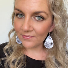 Load image into Gallery viewer, black and white halloween teardrop earrings on silver hooks.  spiderweb design

