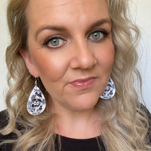 Load image into Gallery viewer, black and white halloween teardrop earrings on silver hooks.  sugar skull selfie
