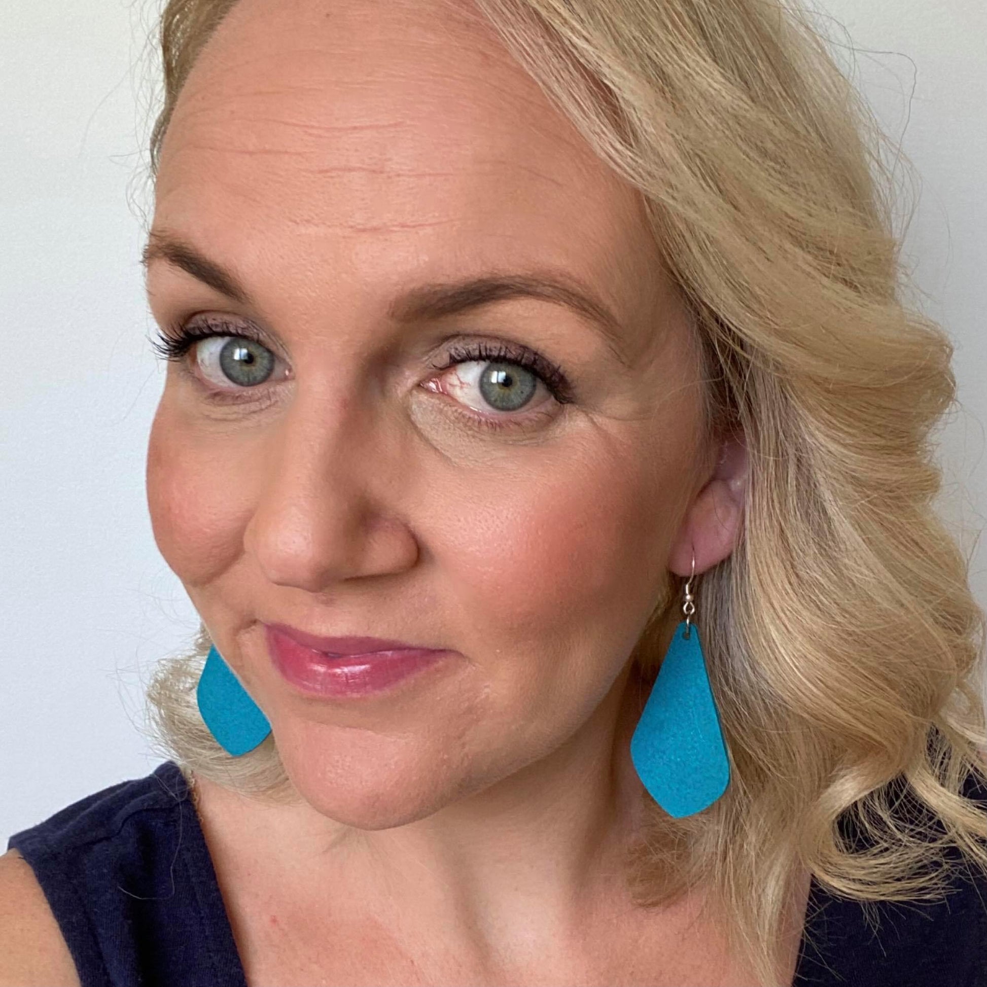 Teal Diamond Drops selfie. Earrings made out of Faux suede leather with silver coloured hooks.