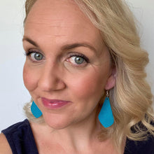 Load image into Gallery viewer, Teal Diamond Drops selfie. Earrings made out of Faux suede leather with silver coloured hooks.

