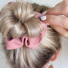 Load image into Gallery viewer, Dusty pink faux leather hair scrunchie around bun
