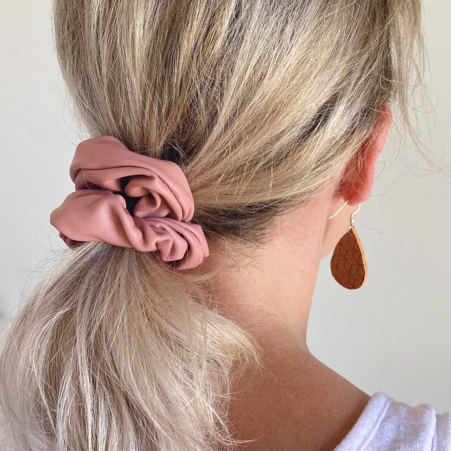 Dusty pink faux leather hair scrunchie in ponytail