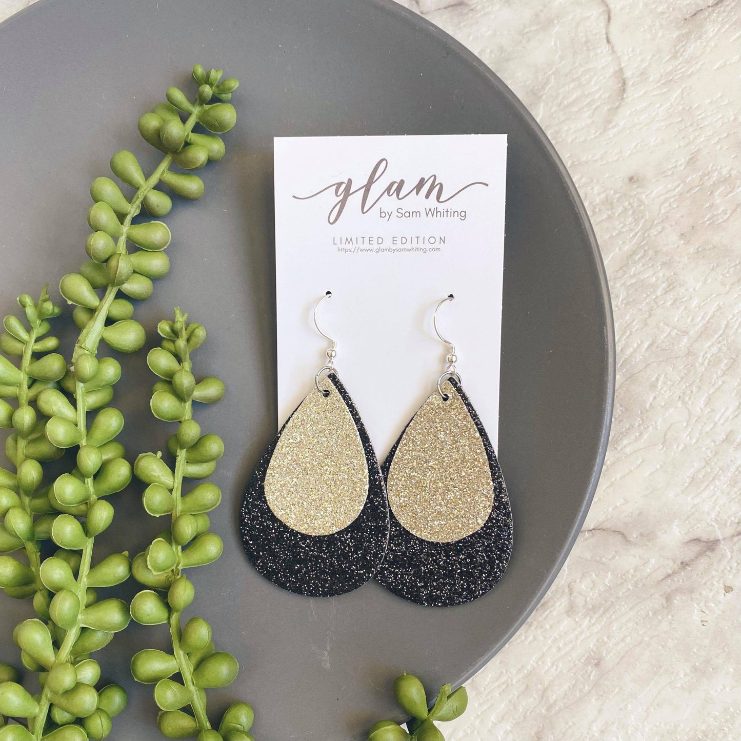 galaxy sparkle. black and silver teardrop shaped leather earrings