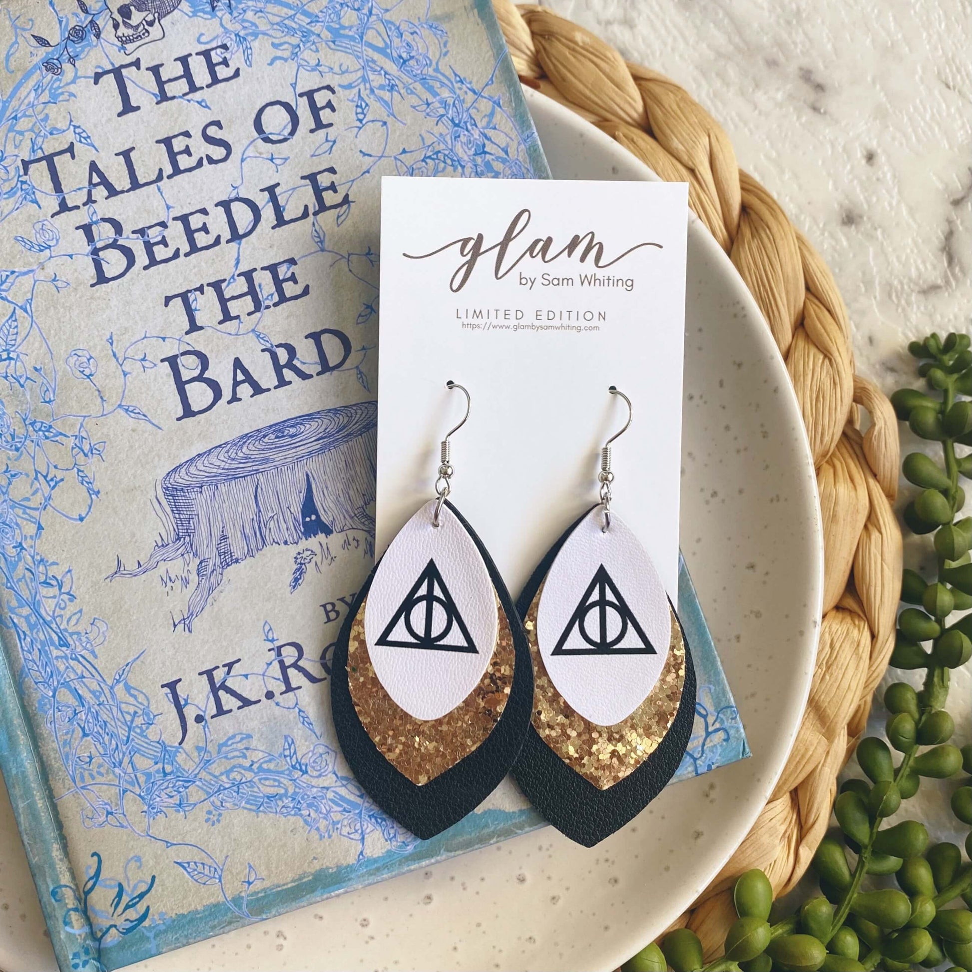 Harry Potter Deathly Hallows inspired leather earrings with a silver coloured hook. 