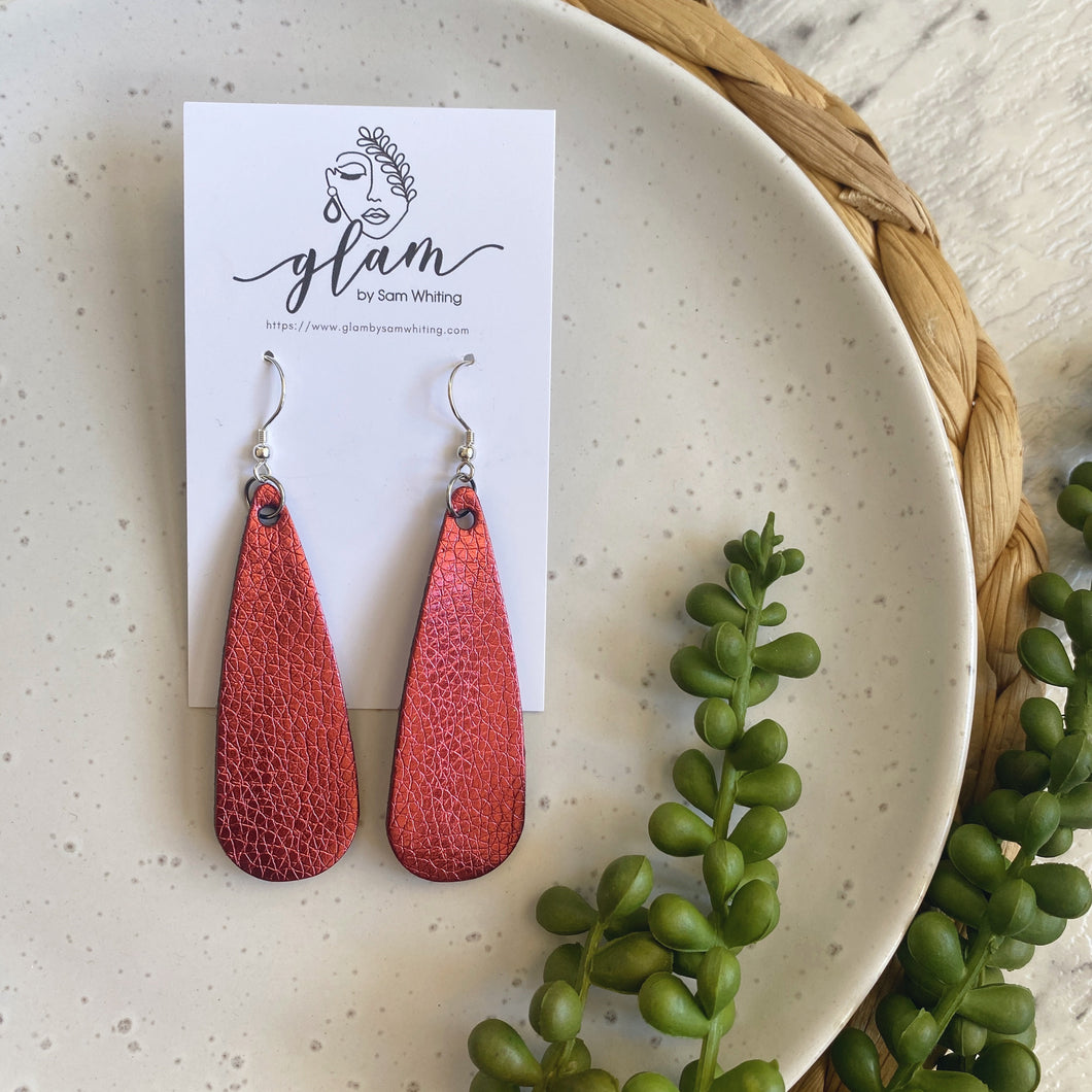 Metallic maroon droplet leather earrings on a silver coloured hook.  
