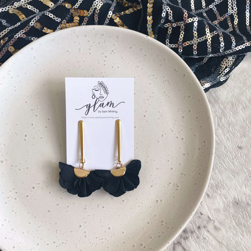 Black Flutter Bar earring stud dangles on a golden coloured hook.
