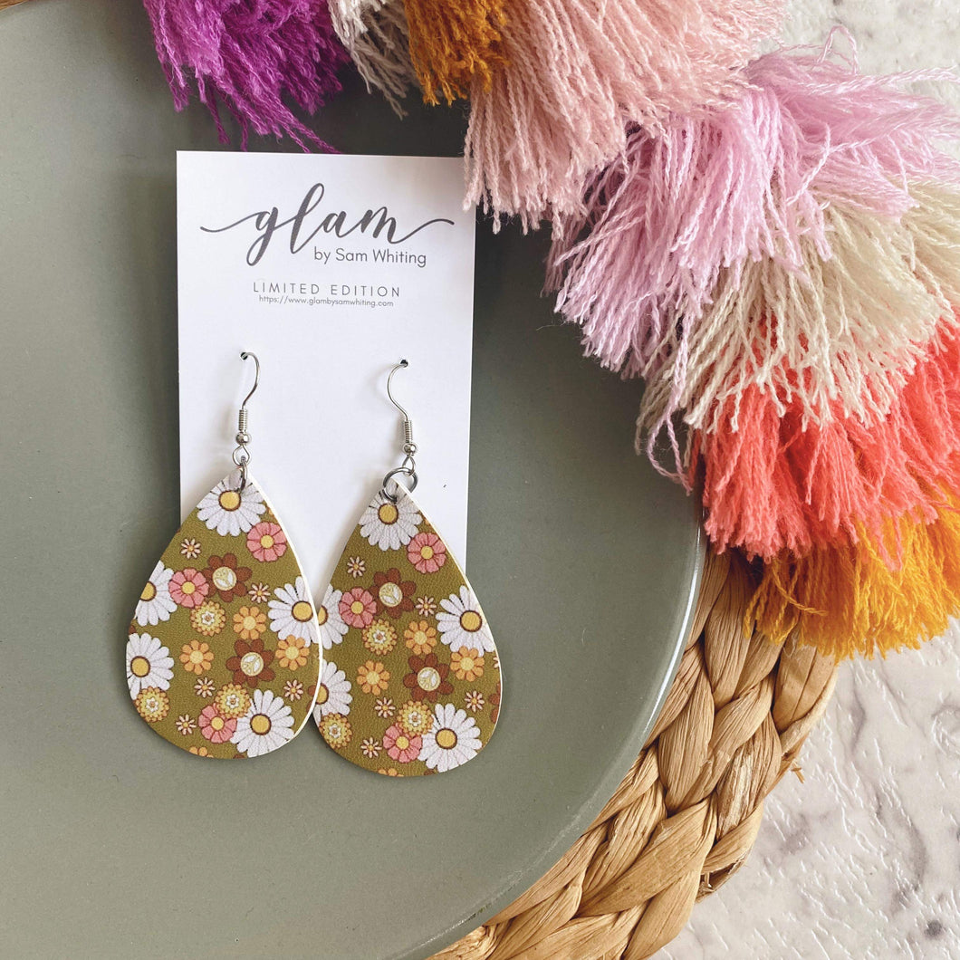 Groovy 70's 60s floral teardrop leather earrings on a silver coloured hook. 