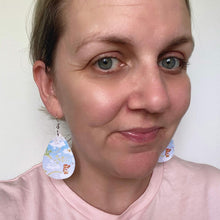 Load image into Gallery viewer, Care Bears inspired leather earrings with a silver coloured hook. 
