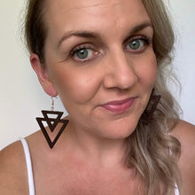 Load image into Gallery viewer, Timber Aztec Triangle shaped leather earrings on a gold coloured hook.  
