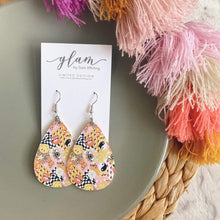 Load image into Gallery viewer, Y2K teardrop leather earrings on a silver coloured hook. 
