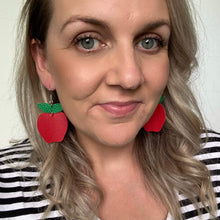 Load image into Gallery viewer, Teacher appreciation christmas gift Apple cut out leather earrings on a silver coloured hook.
