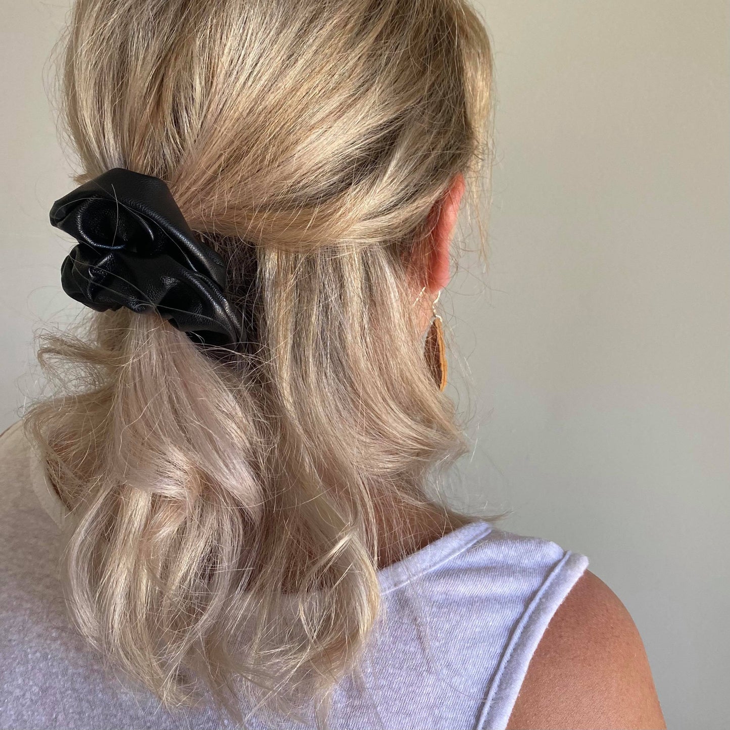 Black faux leather hair scrunchie half up half down style