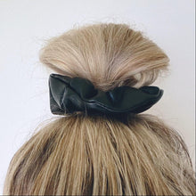 Load image into Gallery viewer, Black faux leather hair scrunchie in top knot
