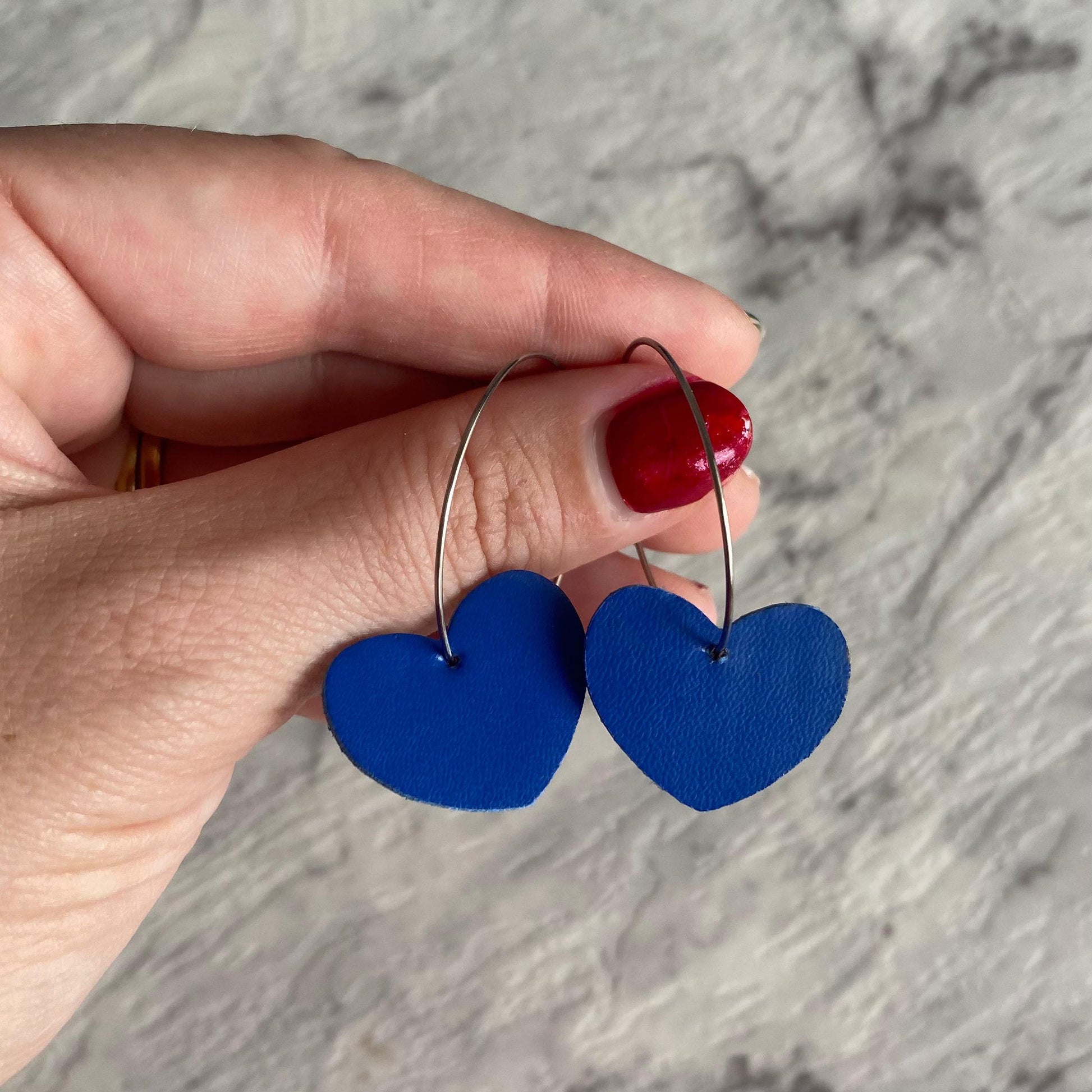 cobalt blue Heart hoop earrings. Faux leather with silver coloured hoops.