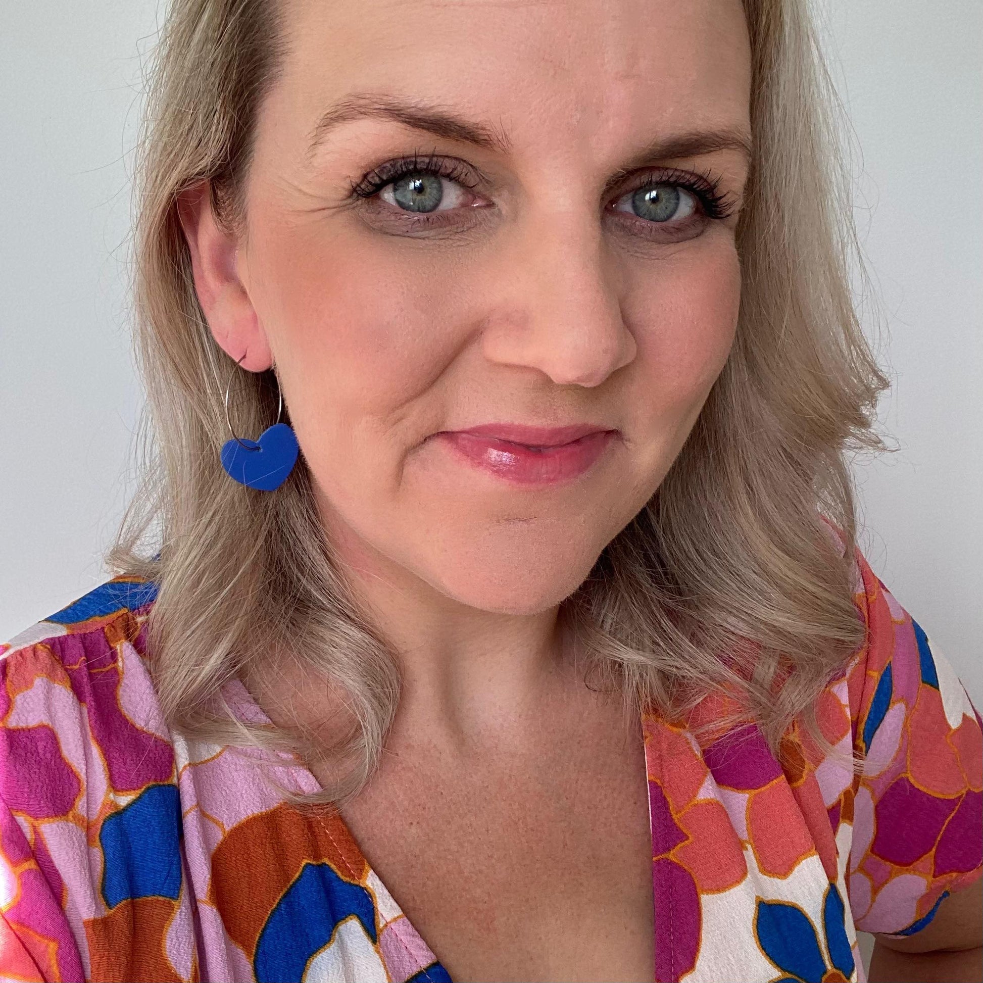 Heart hoop leather earrings. Faux leather with silver coloured hoops. cobalt blue