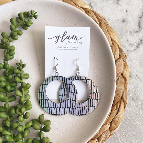 Holographic O hoop leather earrings with a silver coloured hook. 