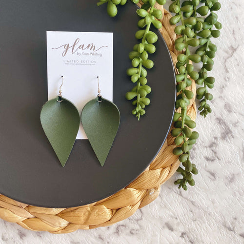 Khaki petal leather earrings with a silver coloured hook. 