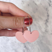 Load image into Gallery viewer, Pink heart hoop earrings. Faux leather with silver coloured hoops.
