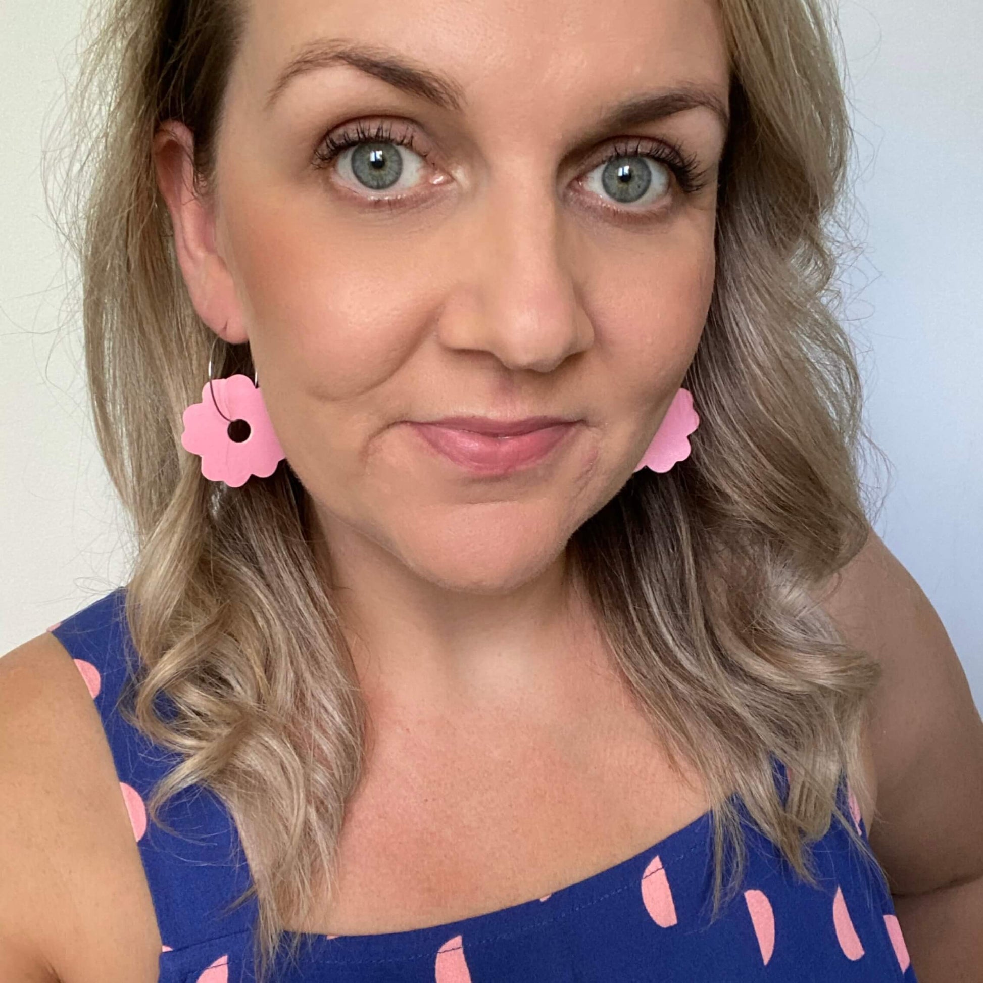 Pink Flower hoops. Double sided faux leather with silver coloured hoops. earrings