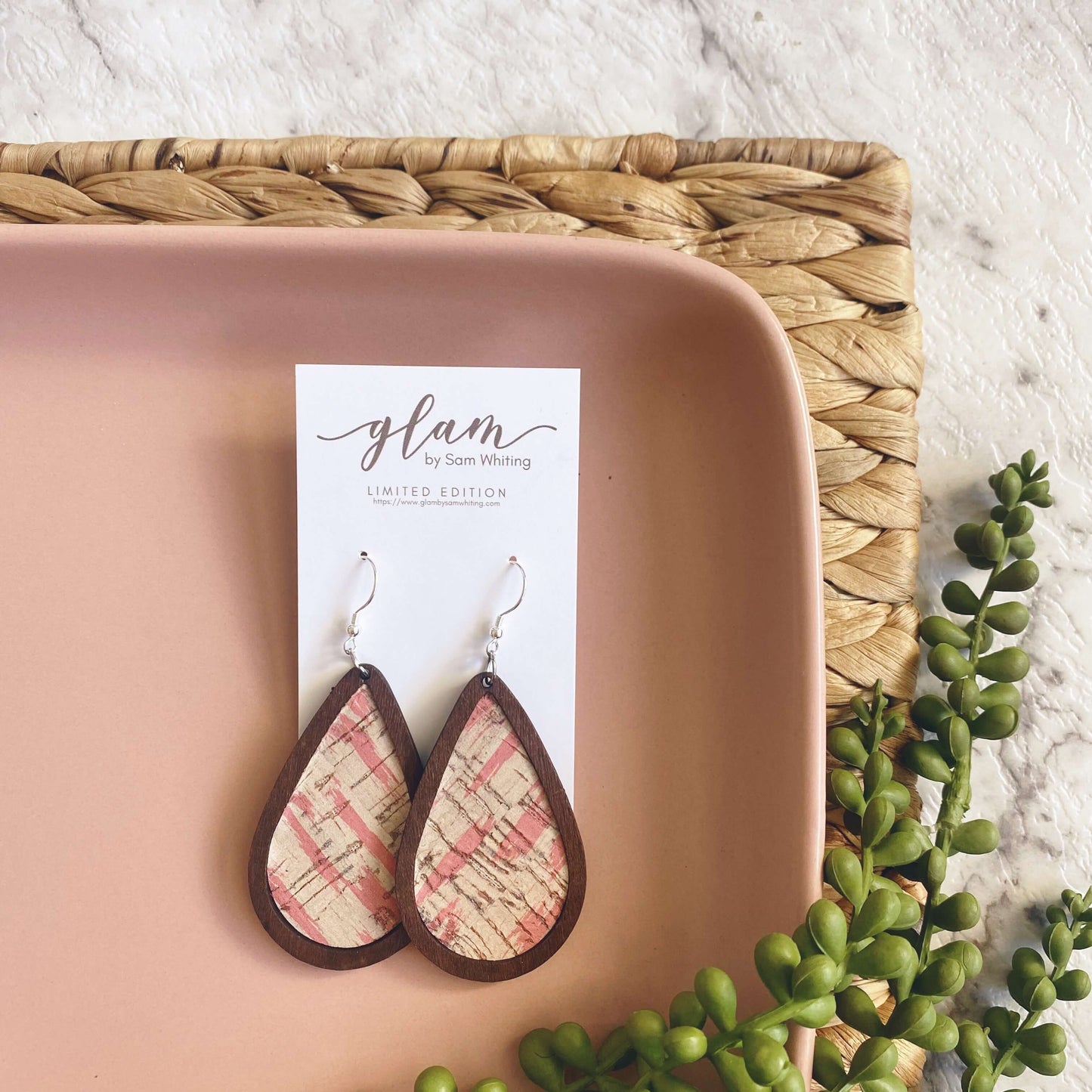 Framed Abstract pink leather earrings with a silver coloured hook. 