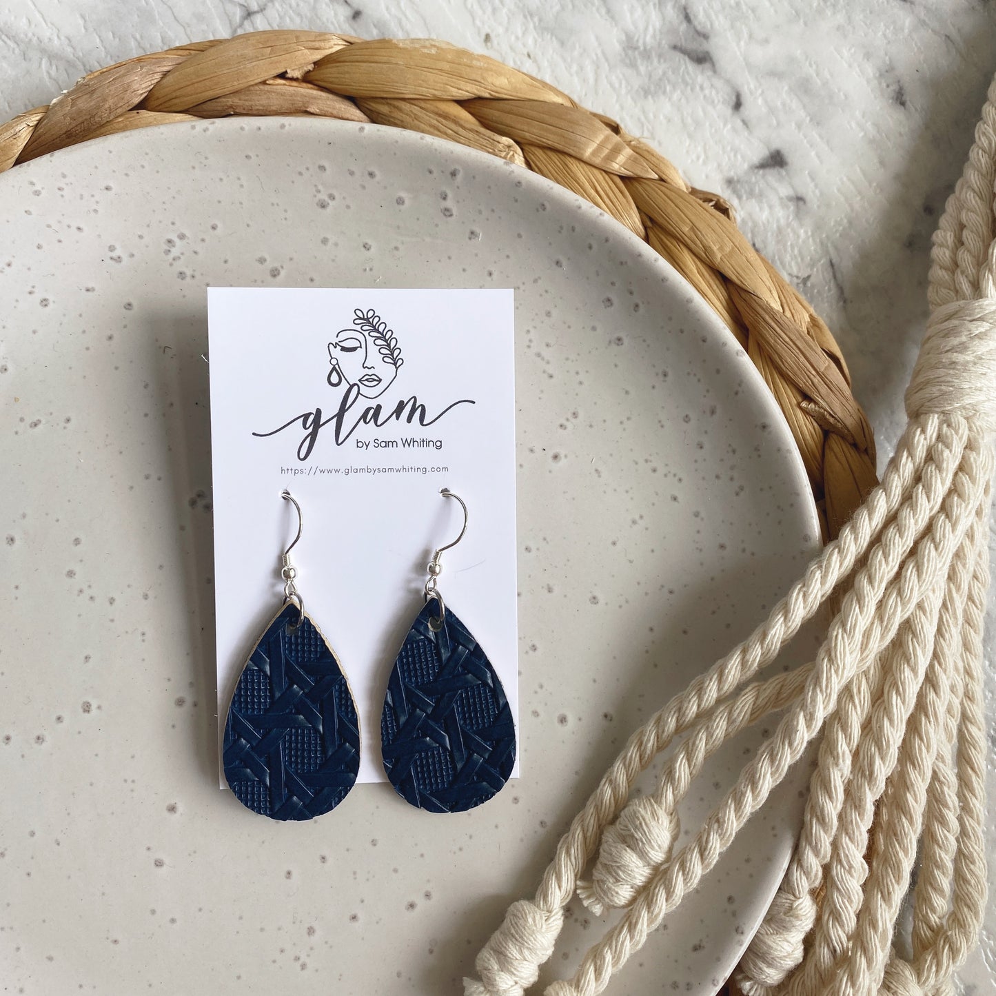 Navy Rattan mini leather earring with silver coloured hook.