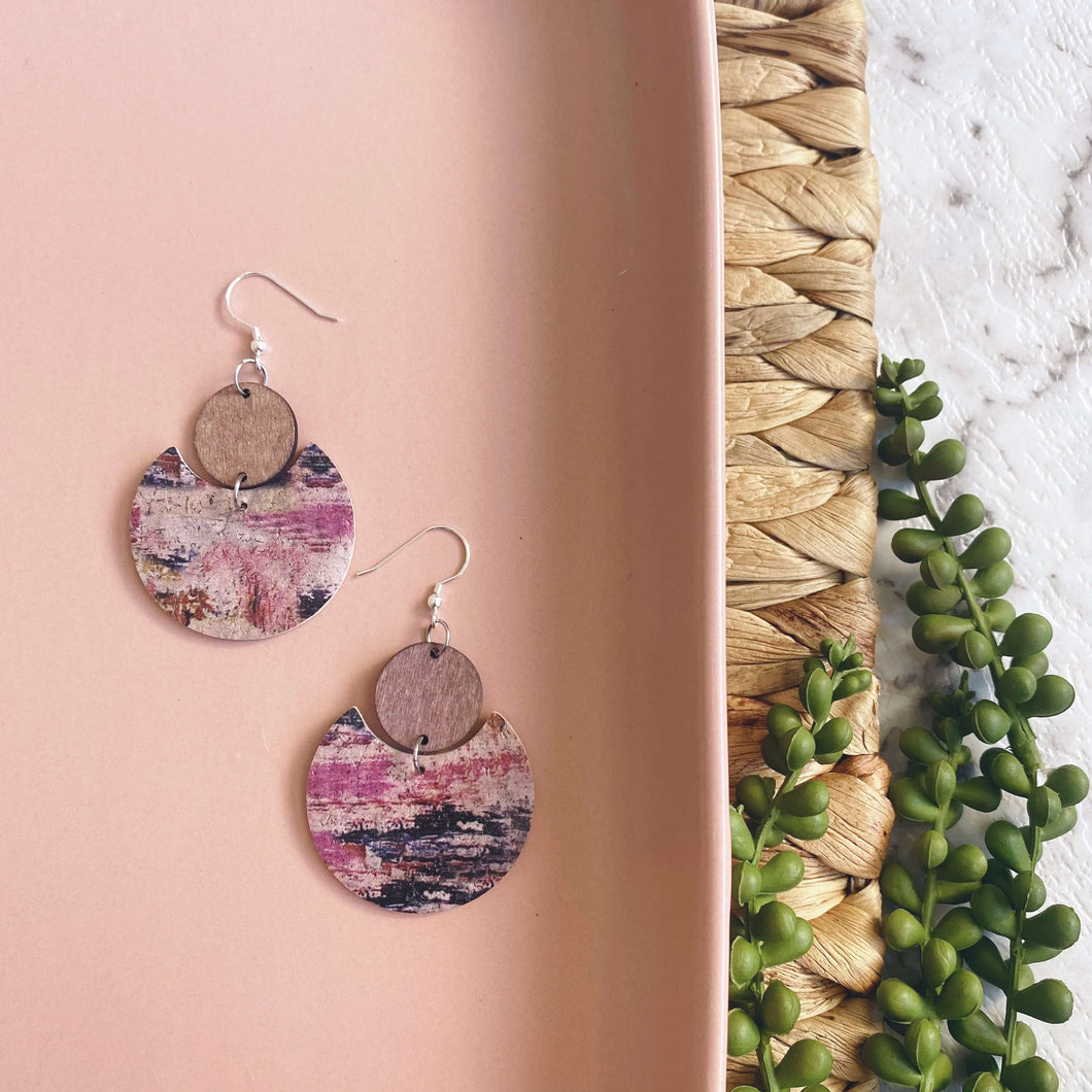 Mushroom crescents with timber circle on a silver coloured hook. 