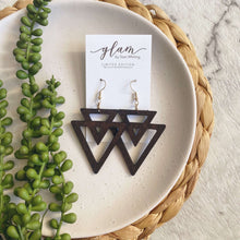 Load image into Gallery viewer, Timber Aztec Triangle shaped leather earrings on a gold coloured hook.  
